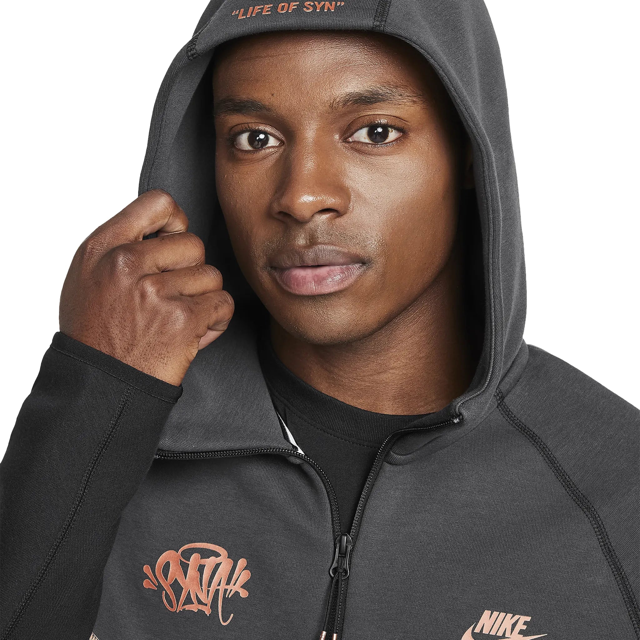 Model hood view of Syna World x Nike Central Cee Tech Fleece Black Hoodie HQ3748-010